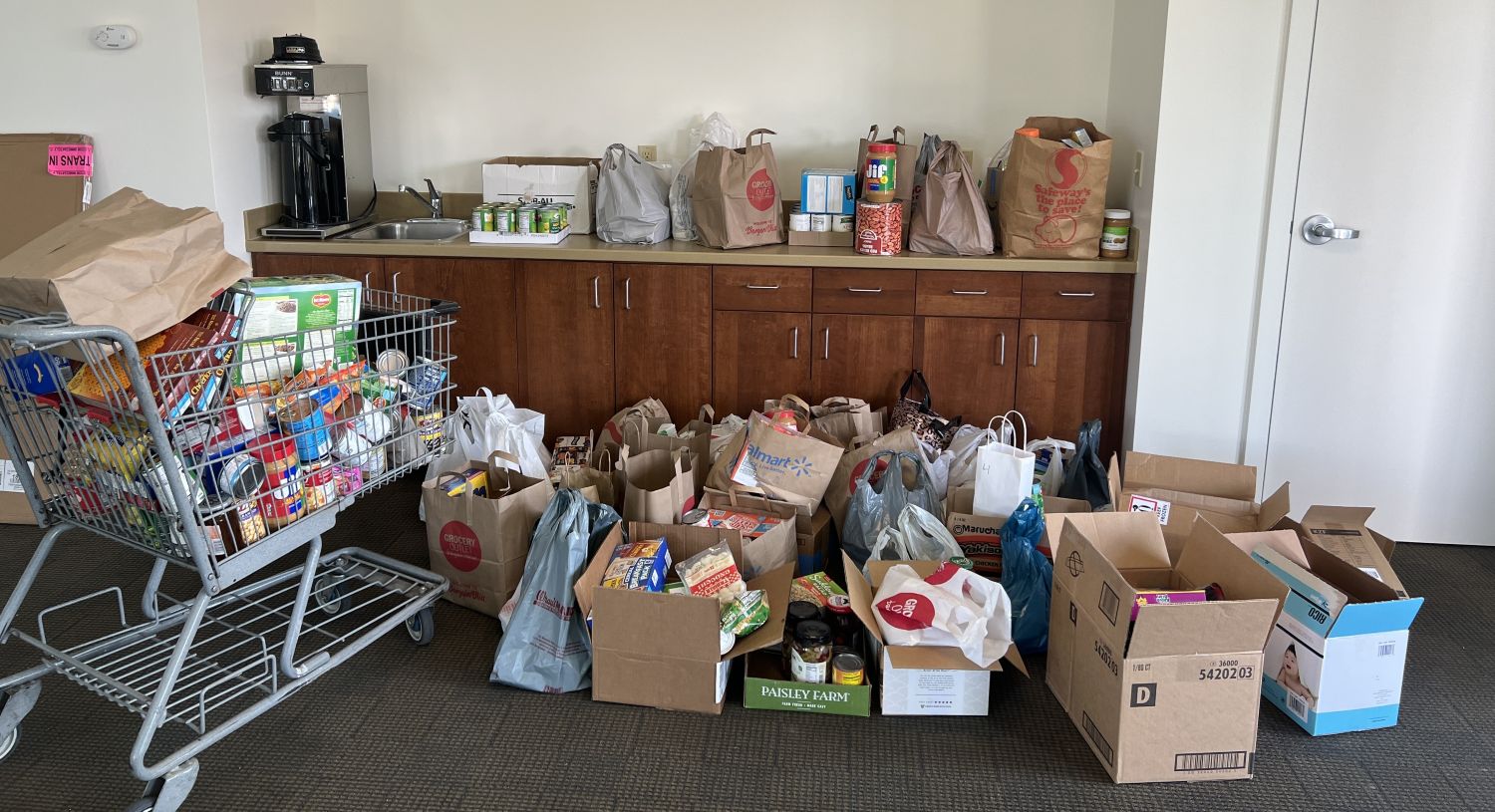 shred-day-food-donations boxes of food donated during Solarity's Community Shred Day and Food Drive event