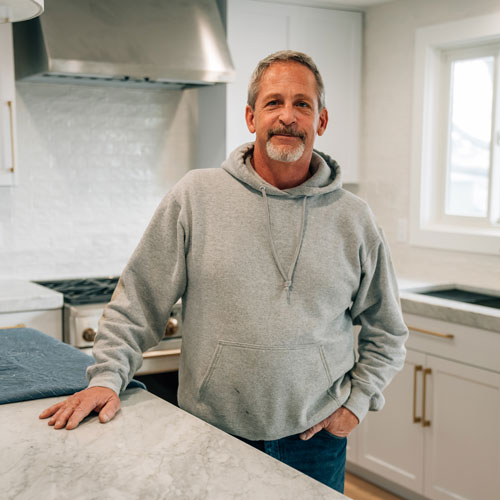 Tim standing in kitchen remodel