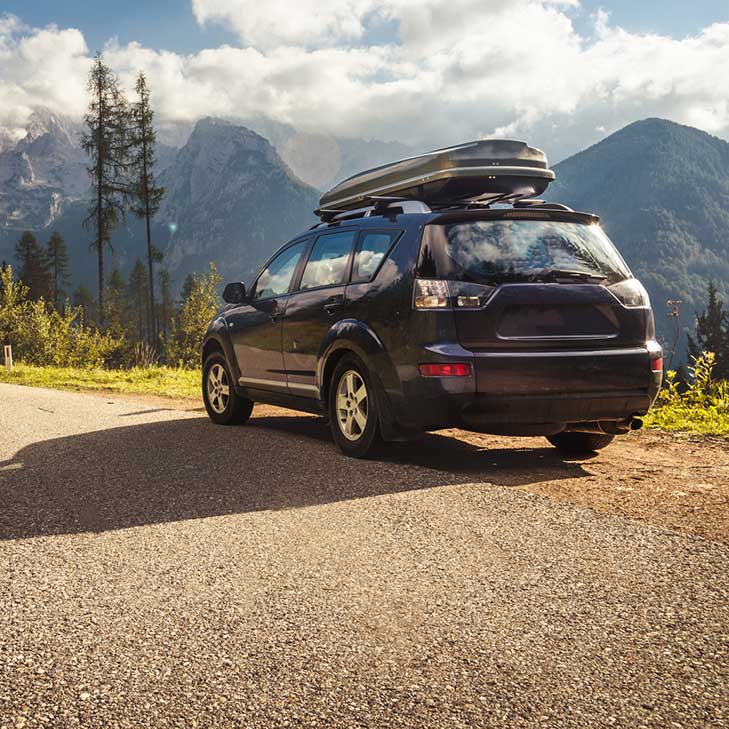 Pre-approved SUV driving through PNW mountains