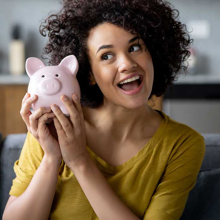 Woman holding Bonus Savings piggy bank