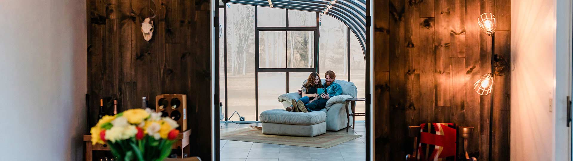 Man and woman sitting at home and looking at ipad